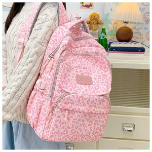 Detailed view of a pink leopard print large capacity backpack for students and travel use