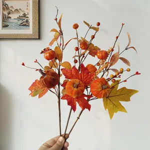 Artificial autumn maple leaf pumpkin decorative branch detail showing rich seasonal colors.
