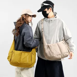 Large capacity waterproof nylon crossbody shoulder bag for men and women, casual dumpling bag.