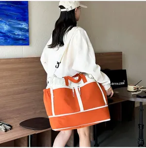 A person carrying a large orange and white travel duffel bag in a casual cafe lifestyle setting