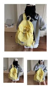 Rear and side views of a stylish yellow large capacity student backpack worn by a model.