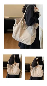 Large beige nylon tote bag shown carried on shoulder for a trendy commuter look