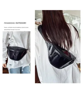 Detail view of the trendy black glossy chest bag, minimalist design for casual wear.