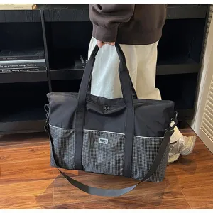 Grand sac de voyage de fitness avec compartiment humide et sec pour le sport et le yoga.