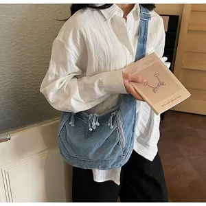 Vintage denim crescent crossbody bag with large capacity and functional multi-pocket detail