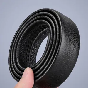 Close-up macro view of a rolled black top grain cowhide leather belt strap with tracking