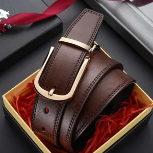 Close-up of men's brown leather belt with gold buckle in an elegant gift box packaging.