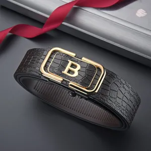 Detailed close-up of a men's black crocodile pattern leather belt with gold B buckle