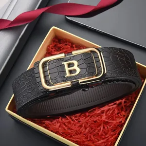 Close-up of men's crocodile pattern leather belt with gold letter B buckle in gift box