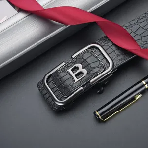 Close-up of crocodile pattern men's belt featuring a silver letter B automatic buckle