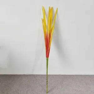 Long European style PE artificial pin-leek grass with yellow and red gradient tips.