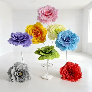 Giant artificial peony flowers set, colorful wedding road guide props and event decor display.