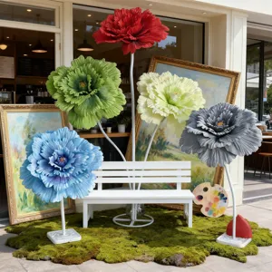 Giant artificial flower scene setup props with white bench for wedding and commercial display.