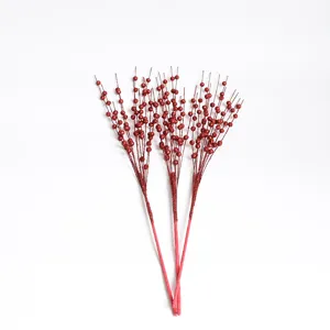 Detailed view of three red glitter artificial foam berry stems for DIY Christmas decoration