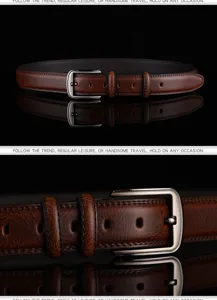 Detailed macro shot of a vintage brown leather belt with a silver-toned pin buckle