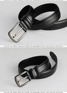 Close-up of men's black leather belt with classic pin buckle and textured finish.