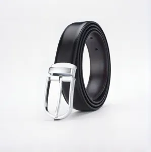 Close-up detail of a minimalist black genuine leather belt with a polished silver pin buckle