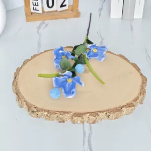 Detailed view of artificial 3-head blue poppy branch on a wooden display slab