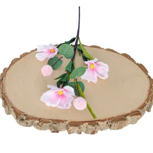Artificial 3-head pink poppy flower branch for home decoration displayed on a wooden slice