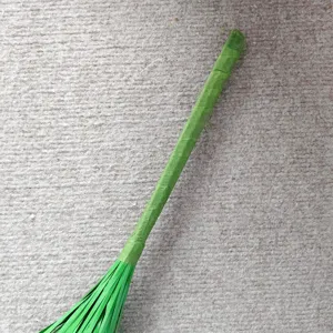 Close up view of green artificial plant stem detail, realistic onion grass floral decor part.