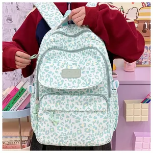 Detailed view of stylish leopard print backpack with large capacity in a room setting