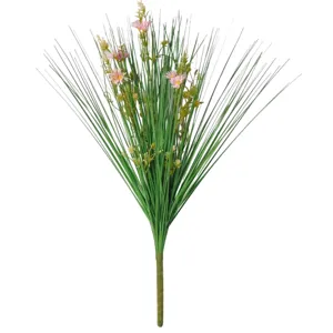 Detailed view of artificial onion grass bouquet with pink flowers, plastic plant decor.