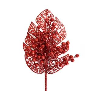 Red glitter monstera leaf with red berries christmas tree decoration party photo prop.