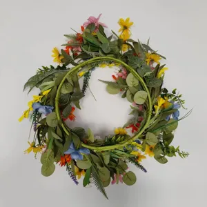 Artificial flower wreath sunflower daisy door hanging home decoration detail close up.
