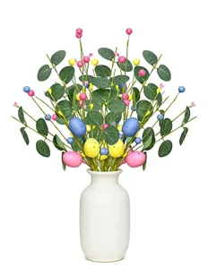 Detail of Easter egg berry stems with green eucalyptus leaves in a white vase.