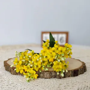 Artificial yellow tung flower bouquet for home decoration, silk floral material detail.