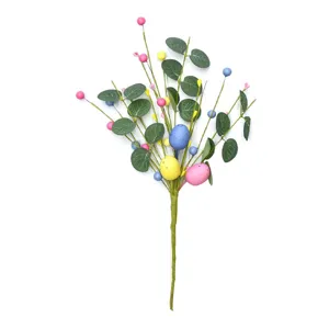 Close-up of Easter egg berry pick with artificial eucalyptus leaves and colorful speckled foam eggs.