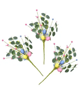 Detail showing three Easter stems with eucalyptus leaves, colorful eggs and berries.