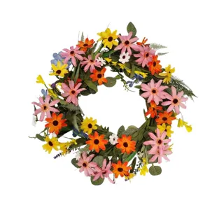 Beautiful artificial flower wreath with sunflowers and daisies for door and home decoration.