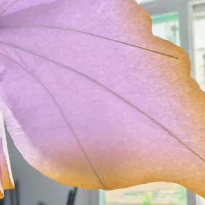 Close-up detail of gradient paper butterfly wing flower petal for wedding stage backdrop decor