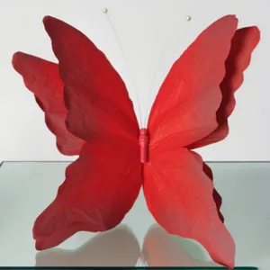 Red gradient 3D paper butterfly decor detail, perfect for wedding stage and window display.