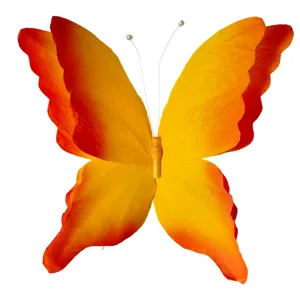 Close-up detail of a 3D gradient orange and yellow butterfly prop for stage and event decor.