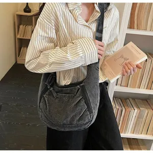 Vintage washed denim dumpling crossbody bag shown on model in library indoor lifestyle setting