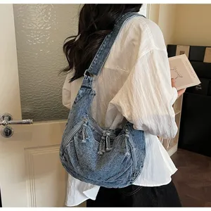 Vintage large capacity denim dumpling shoulder bag for stylish daily casual commuting outfit