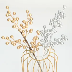 Detailed view of artificial gold and silver berry branches, perfect for home floral decor.