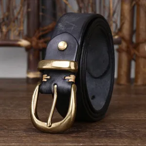 Detail of black leather belt with a vintage brass pin buckle and stitched accents.