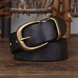 Close-up of 3.3cm wide vintage black leather belt with antique brass buckle detail.