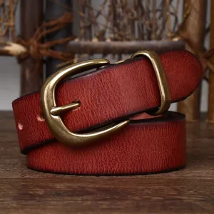 Close-up detail of vintage reddish-brown leather belt featuring an antique bronze pin buckle