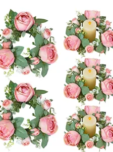 Vista detallada de coronas de velas de rosas artificiales para decoración de bodas