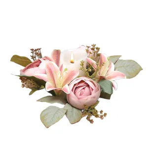Artificial lily and rose candlestick wreath with white candle for romantic home wedding decor.