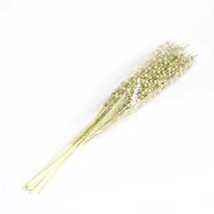 Close-up view of golden glitter foam berry stems for Christmas DIY floral decoration
