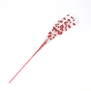 Close-up of red glitter foam ball spray for festive Christmas DIY tree decoration
