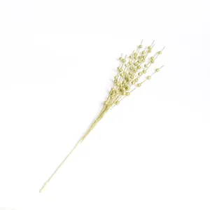Detail of gold glitter foam berries on a decorative Christmas pick stem