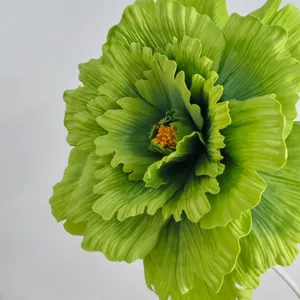 Giant green artificial peony flower close up detail for wedding decor and floral arrangements.