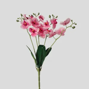 Artificial pink orchid single stem detail view with green leaves and realistic floral design.