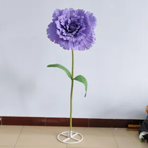 Giant purple artificial flower detail shot, perfect for wedding and event decor props scene.